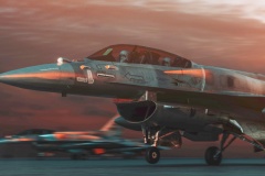 military jet aircraft parked on runway in sunset.
